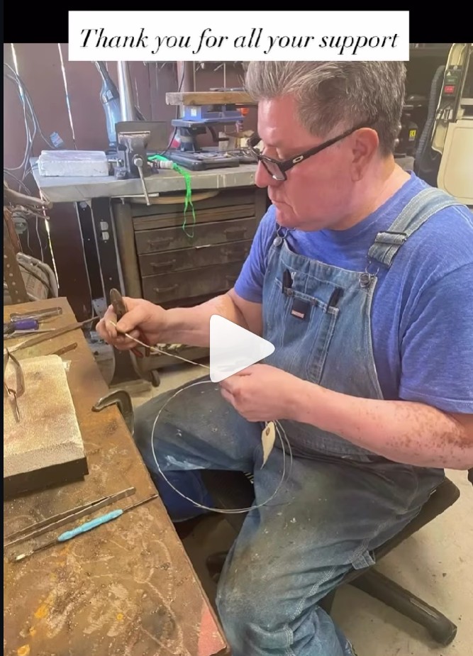 Handmade earrings and rings displayed on a neutral background
